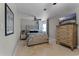 Spacious bedroom with a dresser and a comfortable bed at 632 Country Club Dr, Winter Park, FL 32789