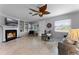 Living room with fireplace, built-in shelves, and hardwood floors at 632 Country Club Dr, Winter Park, FL 32789