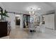 Dining room with a round table and chairs, and a sliding barn door at 632 Country Club Dr, Winter Park, FL 32789