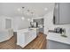 Modern kitchen with gray cabinets, white island, and stainless steel appliances at 2363 Lancashire St, Davenport, FL 33896