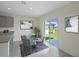 Bright dining area with glass table and chairs, leading to a view of the backyard at 2526 Sage Valley Way, Winter Haven, FL 33884