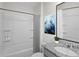 Clean bathroom with a shower/tub combo and granite vanity at 2526 Sage Valley Way, Winter Haven, FL 33884