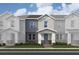 Two story home with gray and white exterior and landscaping at 163 Aulin Ave, Oviedo, FL 32765