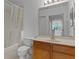 Clean bathroom with wood vanity and shower/tub combo at 1091 Indigo Dr # 201, Celebration, FL 34747