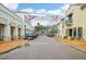 A paved street lined with shops and golf carts at 517 Milano Rd, Poinciana, FL 34759