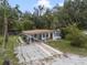 Single story home with covered patio, paved area, and yard at 621 Oaklando Dr, Altamonte Springs, FL 32714