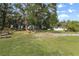 Large backyard with mature trees and picnic tables at 621 Oaklando Dr, Altamonte Springs, FL 32714