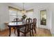 Dining room with wood table, chairs, and chandelier at 621 Oaklando Dr, Altamonte Springs, FL 32714