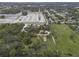 Aerial view showing property with surrounding trees and road at 621 Oaklando Dr, Altamonte Springs, FL 32714