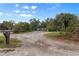Single-story home with driveway and mature trees at 621 Oaklando Dr, Altamonte Springs, FL 32714