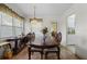Dining room with wood table, chairs, and kitchen access at 621 Oaklando Dr, Altamonte Springs, FL 32714
