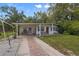 White single story home with covered patio and landscaped yard at 621 Oaklando Dr, Altamonte Springs, FL 32714