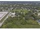 Aerial view showing property with surrounding trees and road at 621 Oaklando Dr, Altamonte Springs, FL 32714