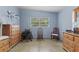 Bedroom with wood dresser, chair, and window with blinds at 621 Oaklando Dr, Altamonte Springs, FL 32714