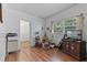 Small bedroom with hardwood floors and window at 621 Oaklando Dr, Altamonte Springs, FL 32714