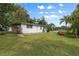 Side yard view of home with grassy area at 621 Oaklando Dr, Altamonte Springs, FL 32714
