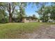 Side view of home with grassy yard at 621 Oaklando Dr, Altamonte Springs, FL 32714