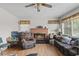 Living room with fireplace, hardwood floors, and comfy seating at 621 Oaklando Dr, Altamonte Springs, FL 32714