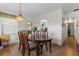 Dining room with wood table and chairs, kitchen view at 621 Oaklando Dr, Altamonte Springs, FL 32714