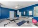 Bright home gym with mirror, mats, and weights at 226 W Tarrington Dr, Deland, FL 32724