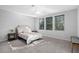 Bright bedroom with carpeted floors and window at 226 W Tarrington Dr, Deland, FL 32724