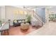 Spacious living room with hardwood floors, a comfy couch, and a window seat at 226 W Tarrington Dr, Deland, FL 32724