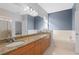 Bathroom with double vanity, tub and window at 226 W Tarrington Dr, Deland, FL 32724