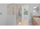 Bathroom with shower and granite vanity at 226 W Tarrington Dr, Deland, FL 32724