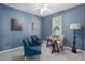 Bright home office features a desk, two chairs, and large window at 226 W Tarrington Dr, Deland, FL 32724