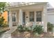 Charming front porch with seating and landscaping at 226 W Tarrington Dr, Deland, FL 32724