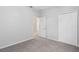 Simple bedroom with carpet, neutral walls, and a large closet at 226 W Tarrington Dr, Deland, FL 32724