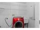 Laundry room with washer, dryer, and shelving at 226 W Tarrington Dr, Deland, FL 32724