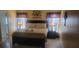 Primary bedroom with a king-size bed and nightstands at 115 Canna Dr, Davenport, FL 33897