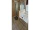 Bathroom features a shower and bathtub at 115 Canna Dr, Davenport, FL 33897