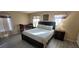 Main bedroom with a king-size bed and crib at 115 Canna Dr, Davenport, FL 33897