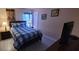 Bedroom with a double bed and nightstand at 115 Canna Dr, Davenport, FL 33897