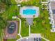 Aerial view of community pool, playground, and parking lot at 947 Grandin St, Davenport, FL 33837