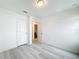 Spacious bedroom with wood-look flooring and ample closet space at 947 Grandin St, Davenport, FL 33837