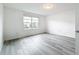 Spacious bedroom with vinyl plank flooring and window at 947 Grandin St, Davenport, FL 33837