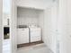 Laundry closet with washer and dryer and shelving at 947 Grandin St, Davenport, FL 33837