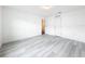 Bright bedroom with vinyl plank flooring and a window at 947 Grandin St, Davenport, FL 33837
