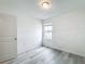 Bright bedroom with vinyl plank flooring and a window at 947 Grandin St, Davenport, FL 33837