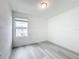 Simple bedroom with vinyl plank flooring and a window at 947 Grandin St, Davenport, FL 33837