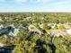 Neighborhood overview with many houses and lush trees at 2551 Oak Hammock Preserve Blvd, Kissimmee, FL 34746