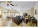 Comfortable living room featuring leather sofas and a large flat-screen TV at 2551 Oak Hammock Preserve Blvd, Kissimmee, FL 34746