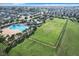 Aerial view of community amenities including pool, playground, and open space at 653 Persian Dr, Haines City, FL 33844