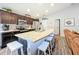 Modern kitchen with stainless steel appliances and an island with seating at 653 Persian Dr, Haines City, FL 33844