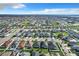 Neighborhood wide aerial view, many homes with solar panels at 653 Persian Dr, Haines City, FL 33844