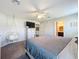 Bright bedroom with a comfortable bed and ceiling fan at 653 Persian Dr, Haines City, FL 33844