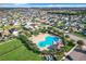Community pool with surrounding lounge area at 653 Persian Dr, Haines City, FL 33844